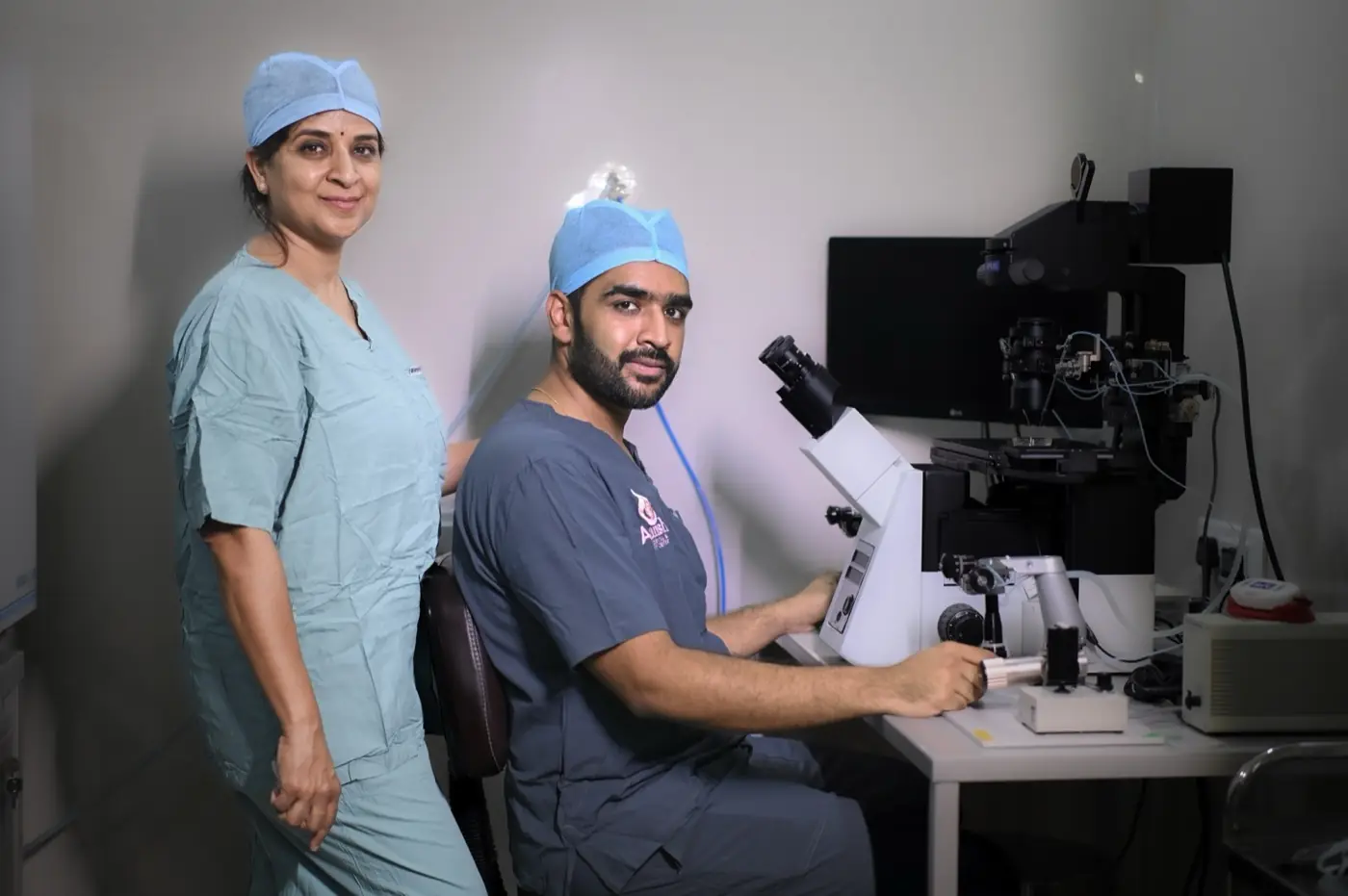 Dr. Shweta Agarwal and Aayush Agarwal, Ph.D., at the ICSI workstation in the Aansh IVF embryology lab